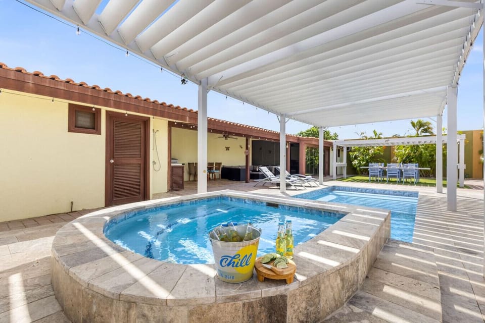 Unwind in the jacuzzi with a chilled drink and let the island vibes sink in.