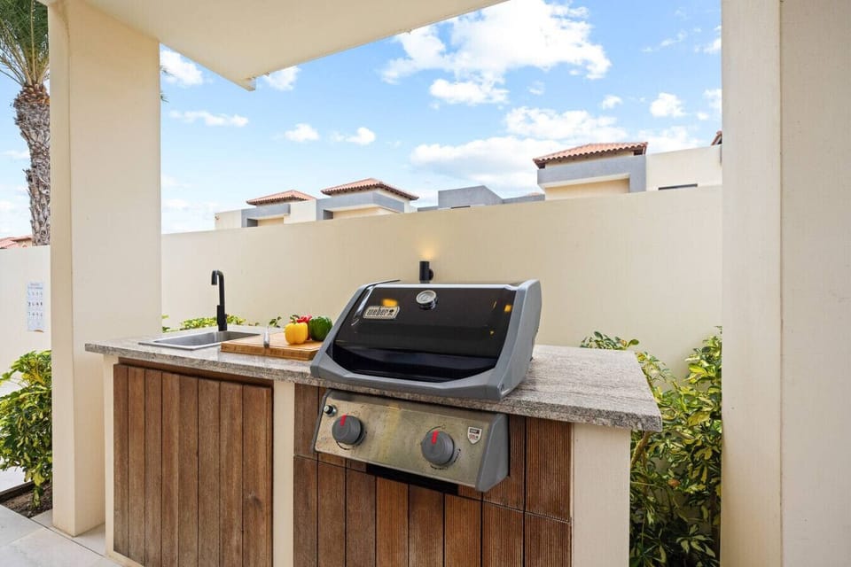 Savour smoky flavours at the outdoor grill, perfect for sunset feasts.
