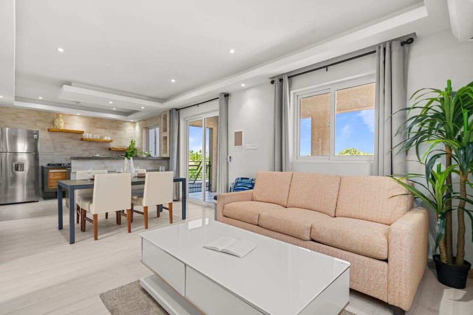 Bright living room with dining table and sofa