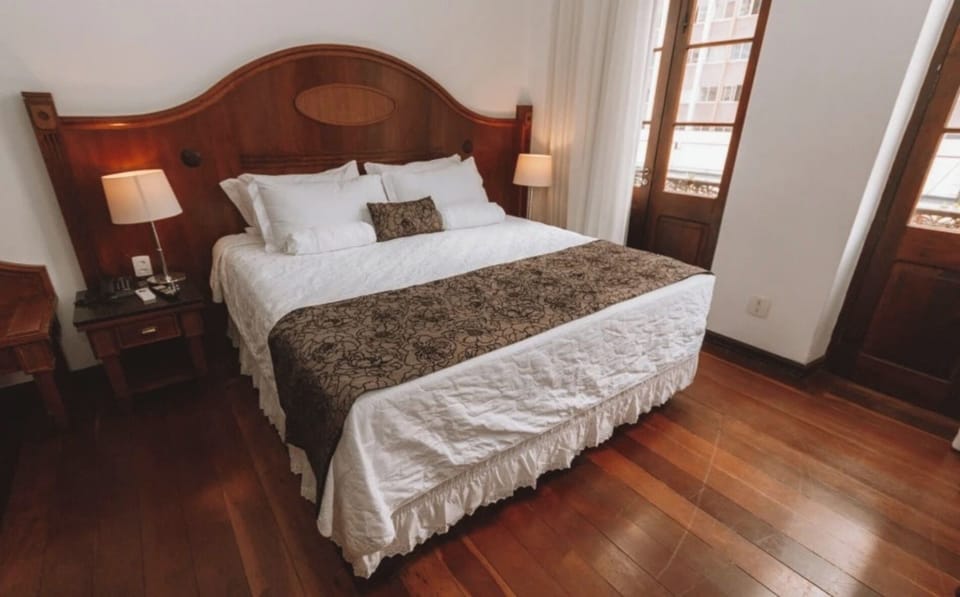 Wake refreshed in a sunlit room with crisp linens.