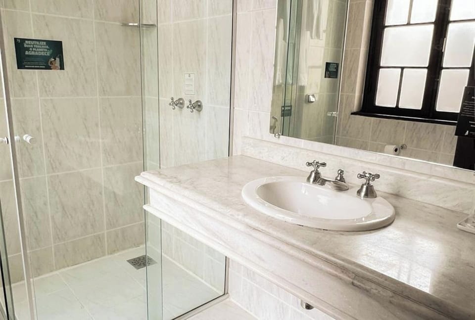 Start your day with a clean vanity and spacious shower.