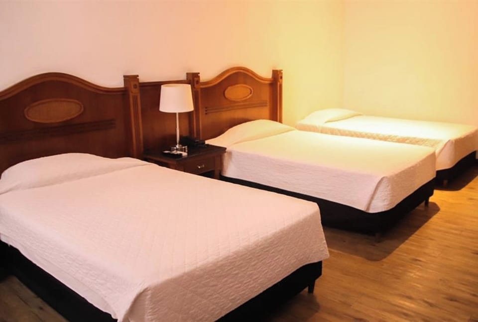 Recharge in simple, airy comfort with inviting twin beds.