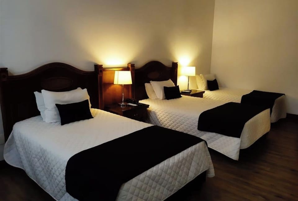 Drift off easily with crisp linens and soft, ambient light.