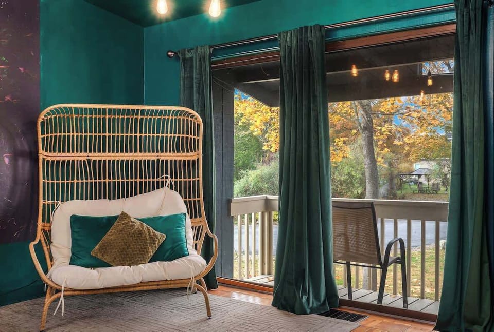 Peaceful porch nook w/ hanging chair swing, the perfect spot to relax and unwind.