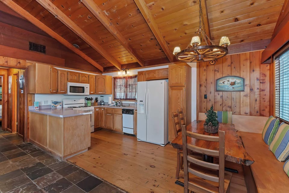 Full kitchen with refrigerator, stove, oven, microwave oven, and dishwasher.