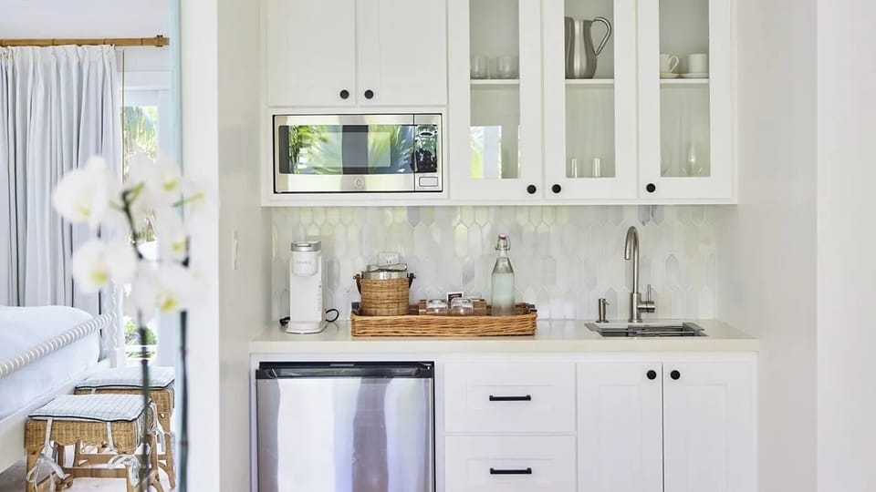 Enjoy easy snacks and drinks in this crisp kitchenette nook.
