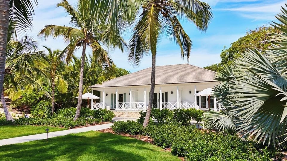 Arrive to a palm-framed villa made for effortless relaxation.