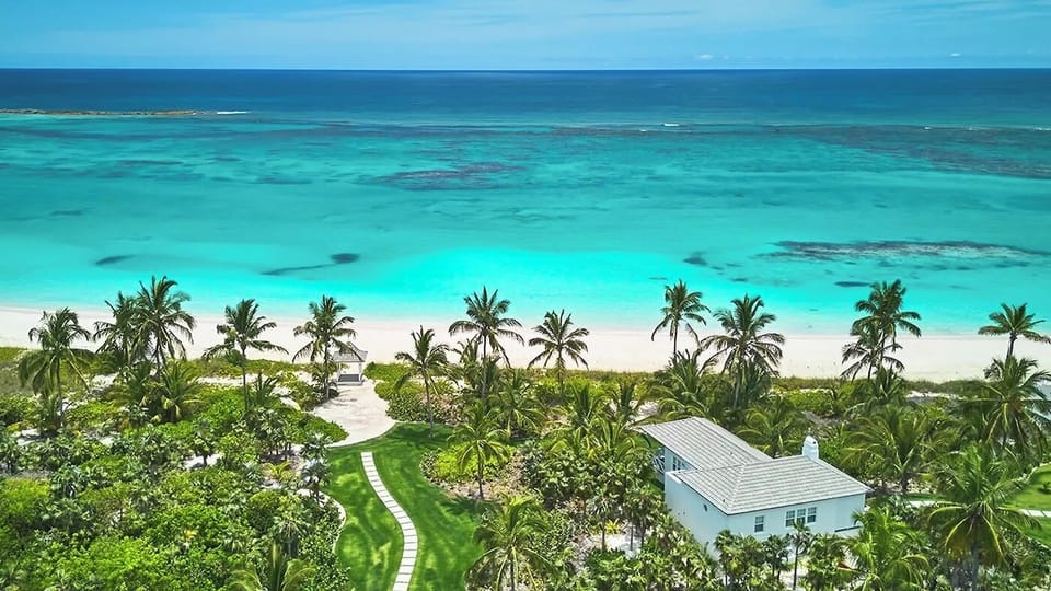 Wake up to turquoise waters and private beachfront serenity.