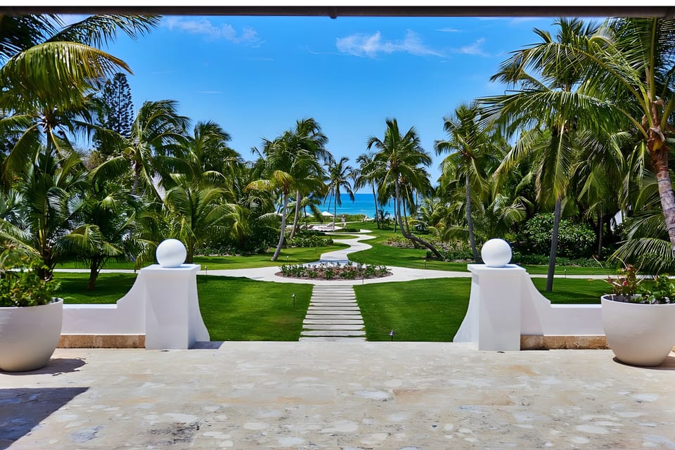 Breathe in ocean breezes as palms frame your arrival.