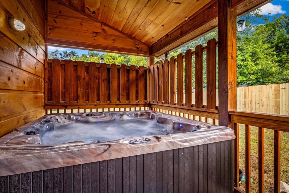 Ease into the bubbling hot tub after a day of exploring. Tucked under a cozy porch, it`s your own private spa retreat — no matter the weather.