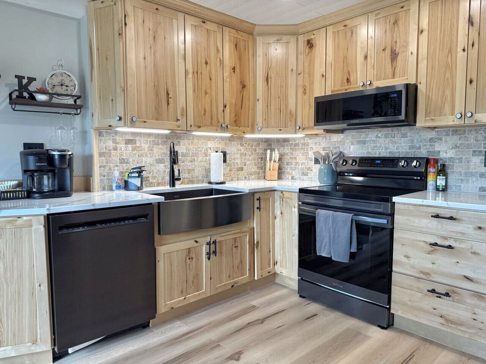 Rustic kitchen with wooden cabinets and appliances