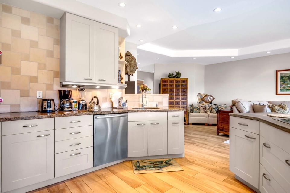 Open-concept kitchen and living space designed for comfort, connection, and effortless island living.