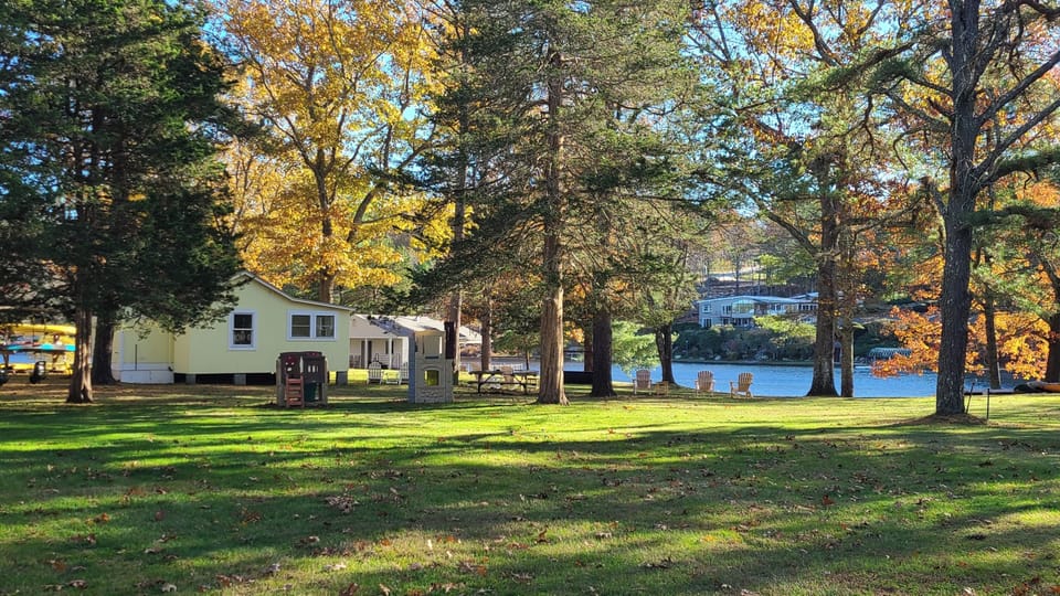 Cabin side view from grass field