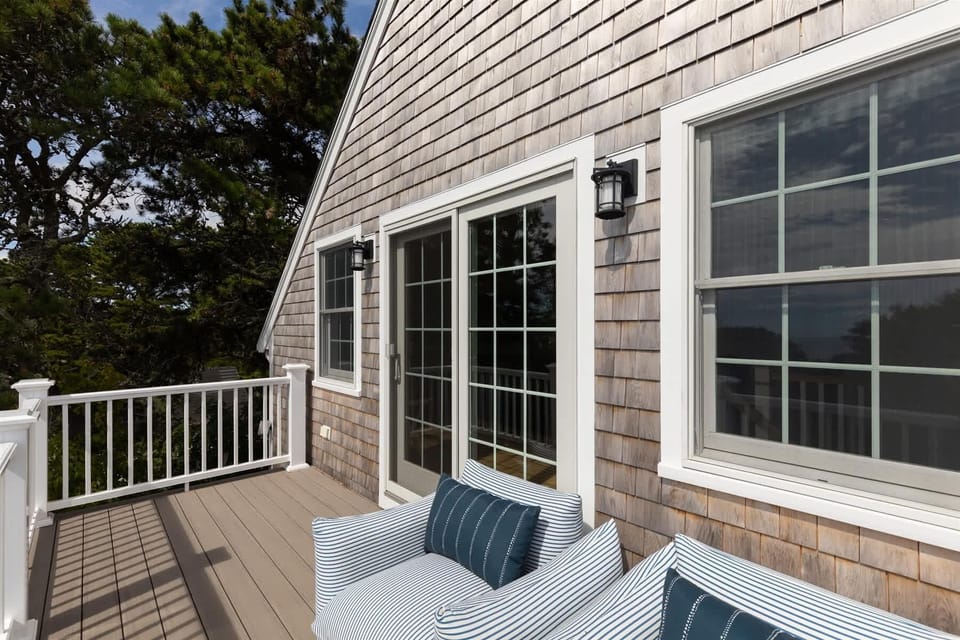 Sunny deck with treetop and sky viewsperfect for morning coffee.