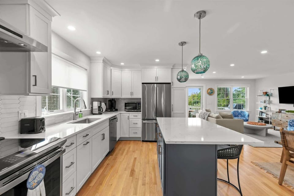 Sleek kitchen with stainless steel appliances and a spacious center island.