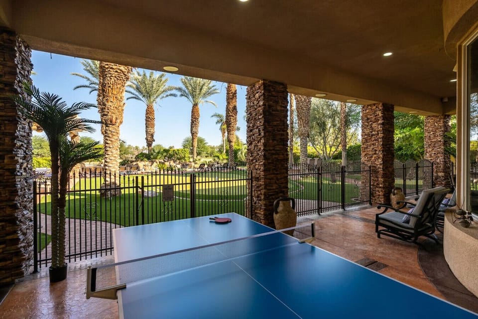 Backyard: covered patio with seating and professional grade ping pong table
