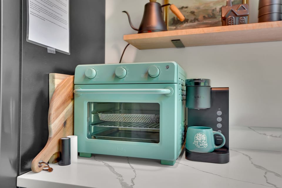 Air fryer-toaster oven, cutting boards, & Keurig coffee maker.