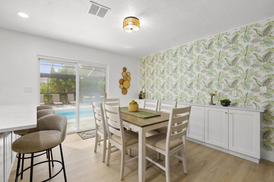 Dining area opening to the pool area