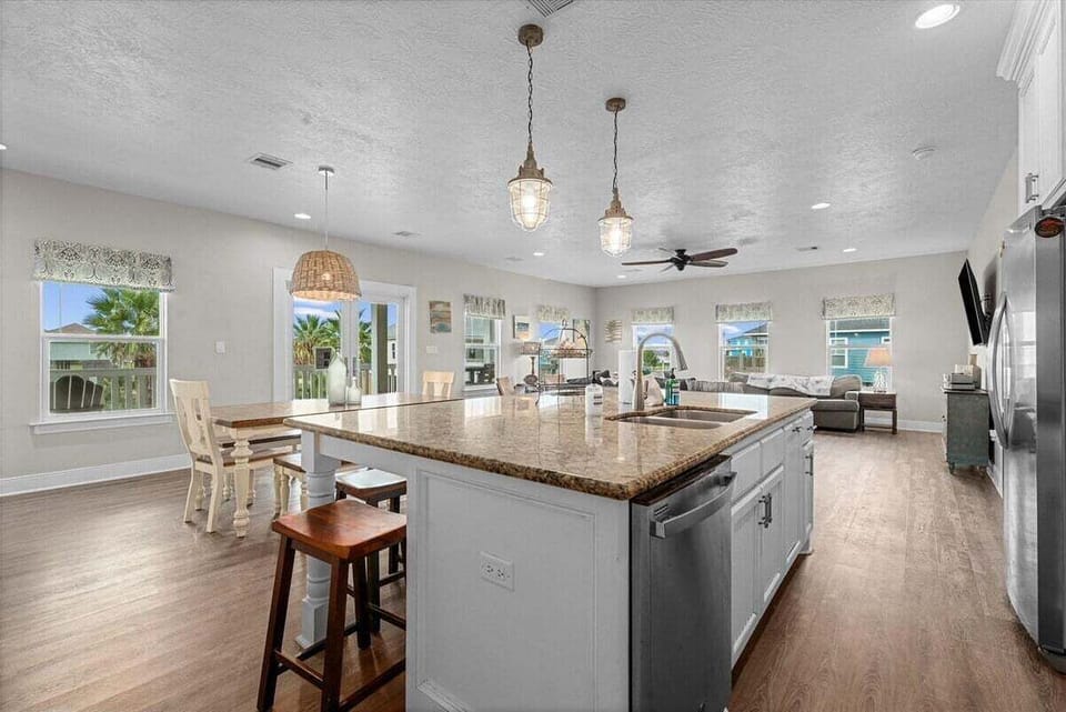 Spacious kitchen with plenty of counter space and seating, ideal for entertaining.