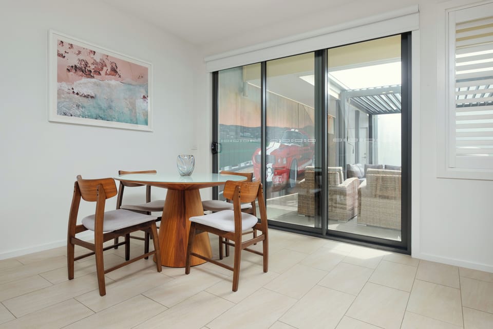 Dining table opens directly to outside & inside cooking areas.