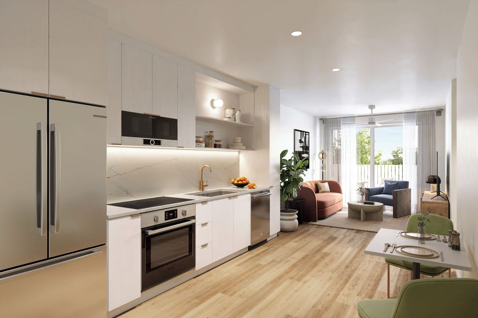 Modern open-concept kitchen and living area with sleek finishes, clean lines, and abundant natural light. (The Code - 305, 306, 307).