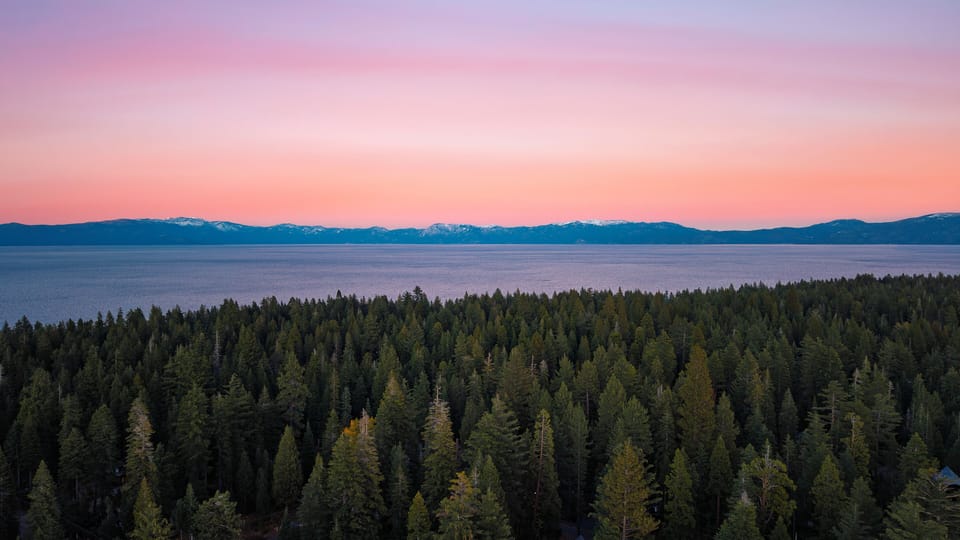 Sunset over forest landscape.