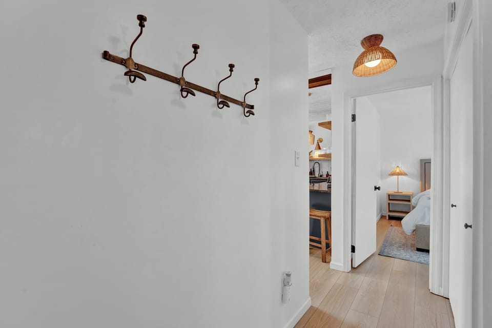 Entryway with Wall Hooks and Storage for Guests