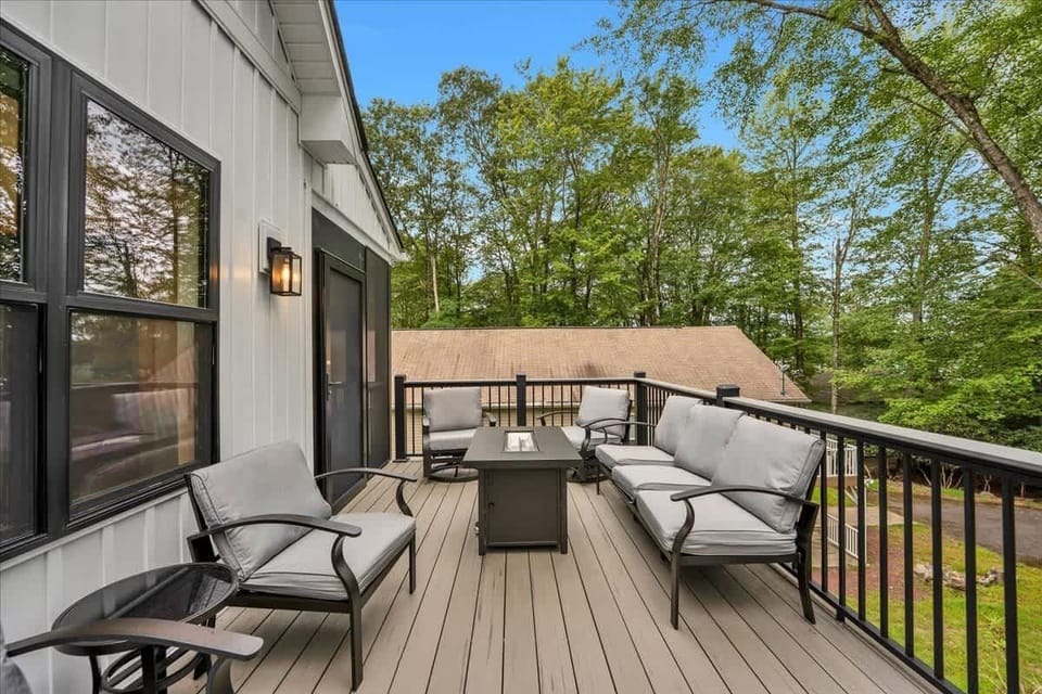 Private balcony seating surrounded by trees