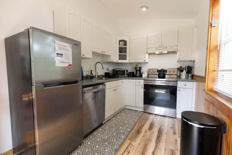 This homes freshly remodeled kitchen is fully equipped for any task, from reheating leftovers to cooking a full thanksgiving dinner