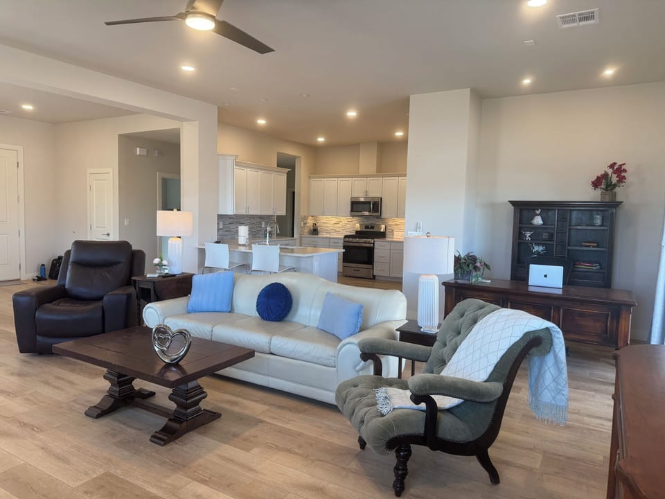 Added recliner and chair in living room.Removed rug to make more pet friendly.