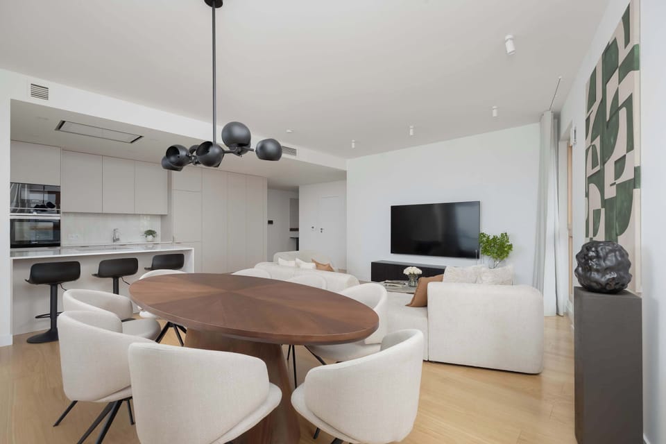 The spacious dining area with designer lighting creates a unique atmosphere for shared meals and cozy evenings with loved ones.