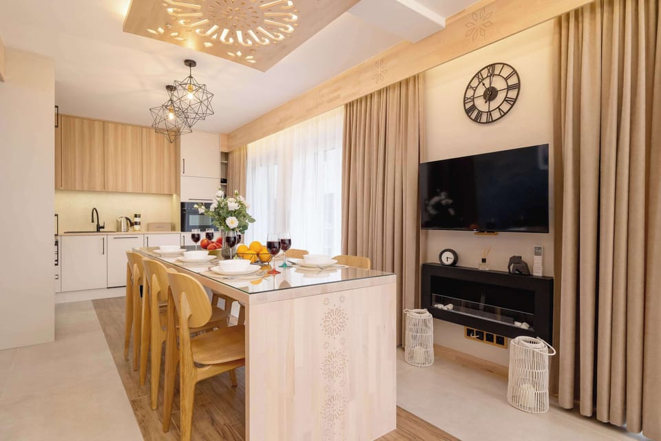 Harmonious combination of dining and kitchen area. On the wall