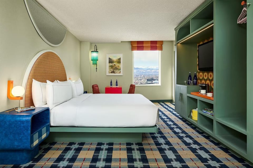 Unwind on a plush king bed in vibrant style.
