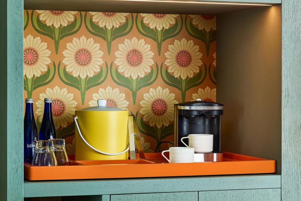Sip morning coffee anytime from your in-room station.