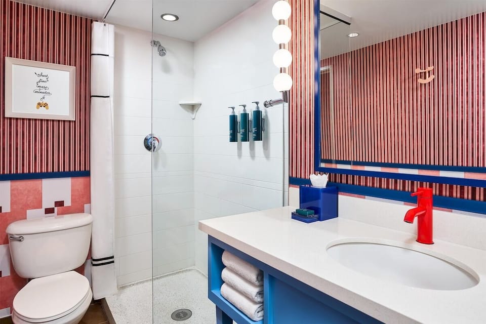 Refresh easily with a sleek shower and bright vanity.