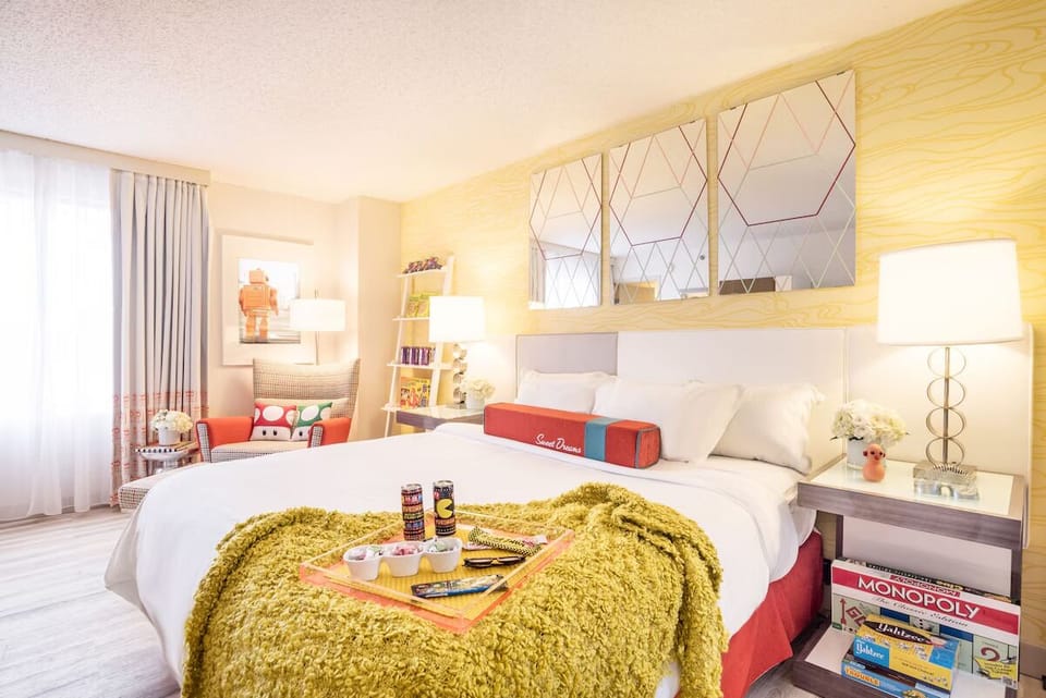 Stretch out on a cloud-soft bed beside cheerful retro accents.