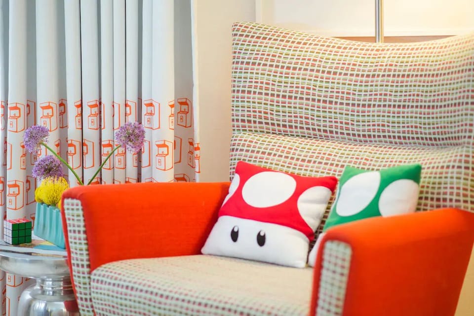 Kick back in a quirky reading nook with colorful, playful pillows.