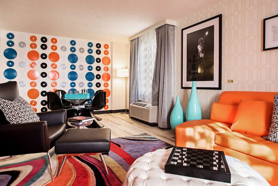 Kick back among bold art and playful, lounge-ready seating.