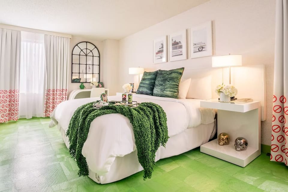 Unwind in a sunlit bedroom with crisp linens and calm style.
