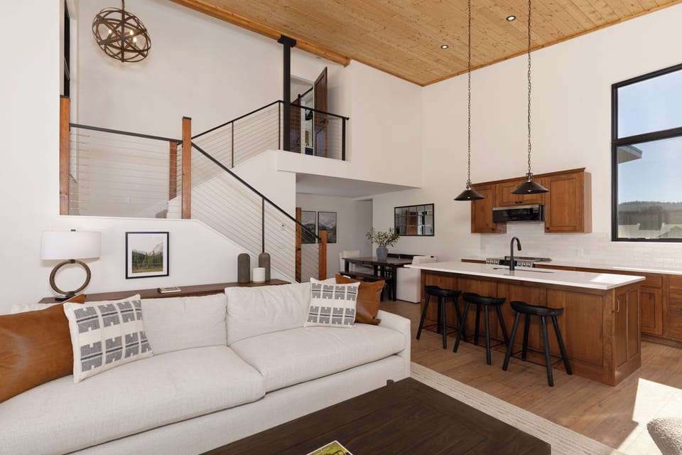Stairs lead to 2nd Floor Master Bedroom overlooking the Greatroom