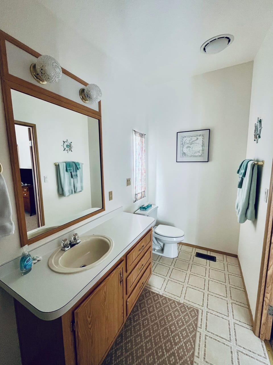Large attached master bath with spacious vanity.