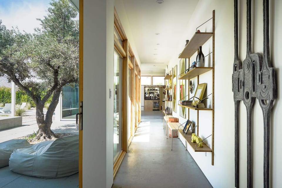 Views of the courtyard with bean bag loungers from the other end of the house. 