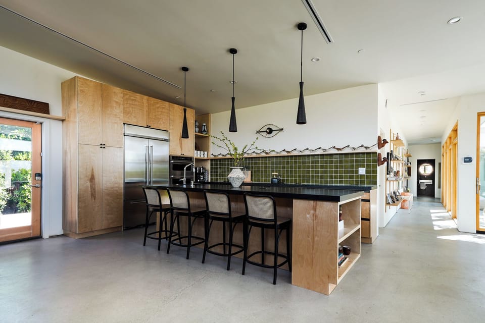 KitchenAid appliances and induction cooktop. Ample cooking space for nights in.