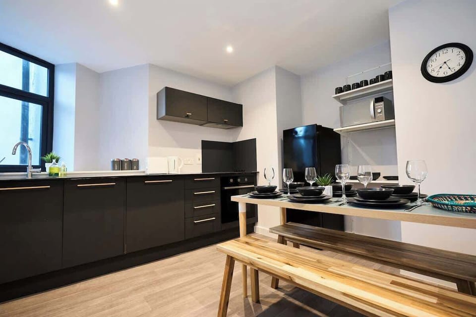 This modern kitchen is fully equipped for everyday cooking needs.