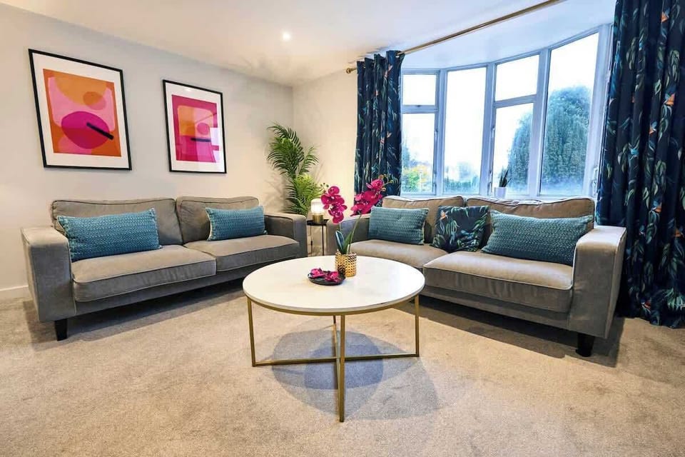 This bright living room offers a welcoming space to relax and unwind.