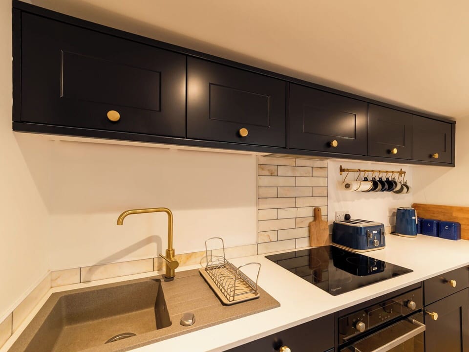 Kitchen, Countertop, Interior Design, Wood, Cabinetry, Kitchen Appliance, Light Fixture, Lighting, Major Appliance, Flooring