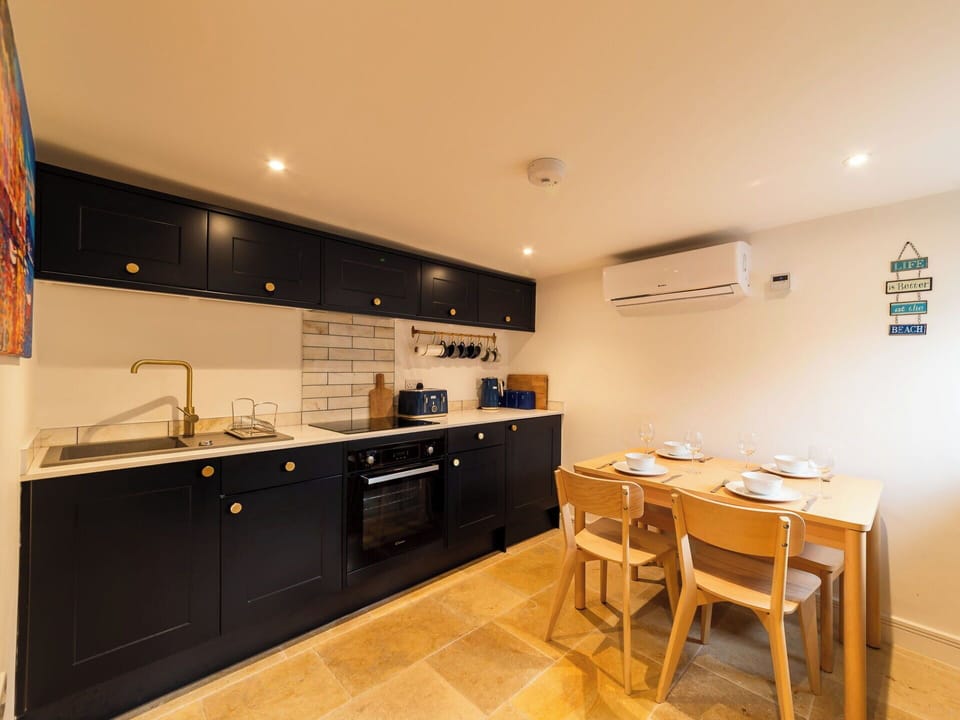 Interior Design, Flooring, Wood, Kitchen, Floor, Countertop, Ceiling, Furniture, Lighting, Cabinetry