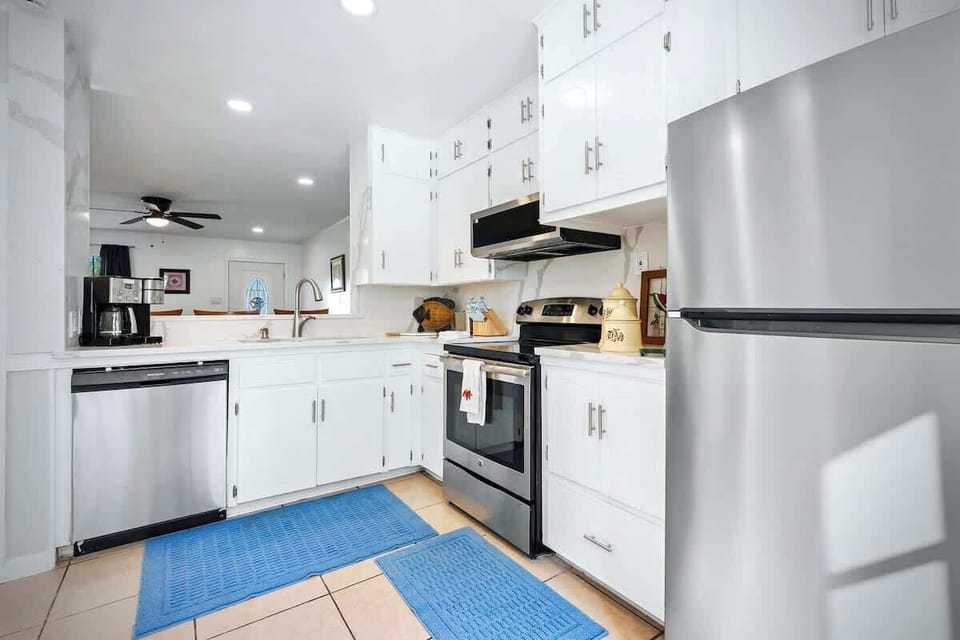 Kitchen: Bright, open kitchen with modern appliances designed for easy meals during travel nurse housing stays in Temple TX.
