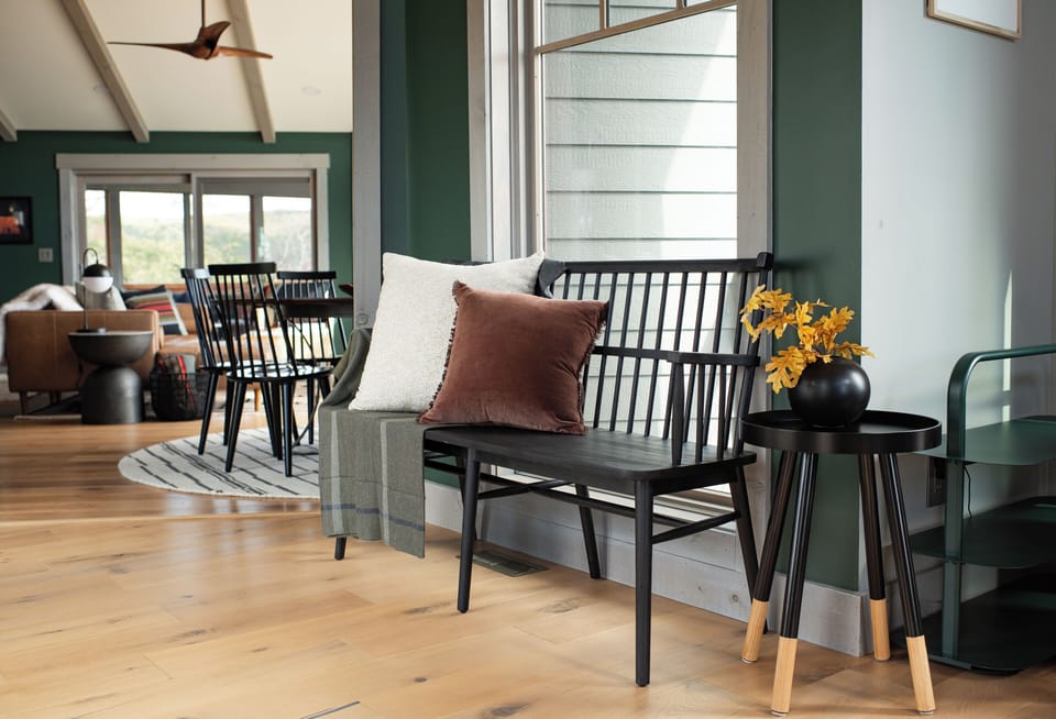 The professionally-designed interiors pair midcentury and organic modern elements with earthy tones and the rich textures expected of a mountain getaway.