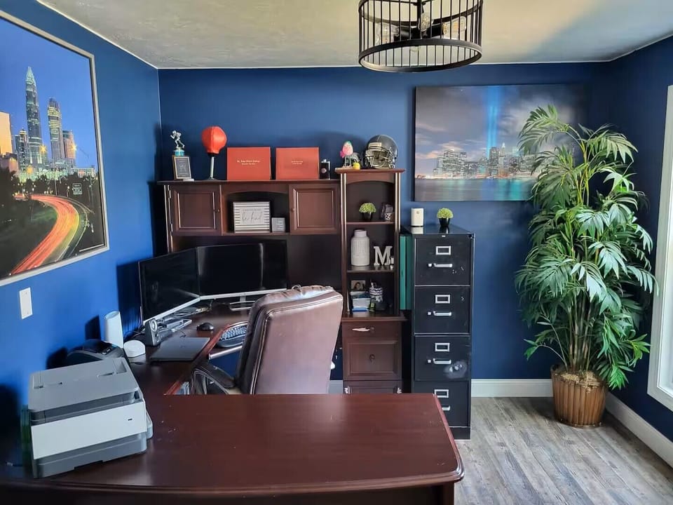 Office with monitors and hub station to connect laptop